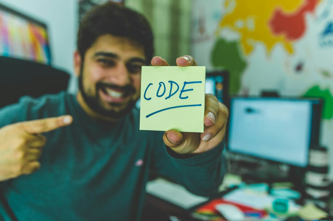 student celebrating coding milestone