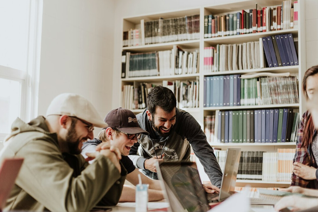 diverse group of students coding together
