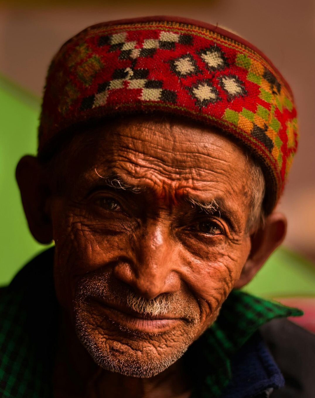 Studio portrait of a young Malay man smiling