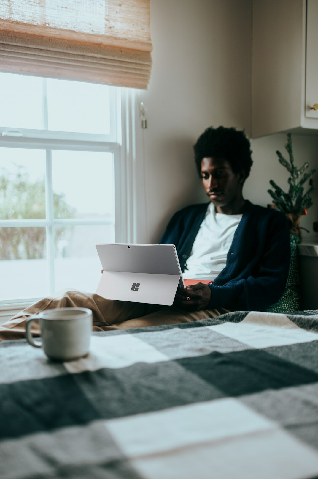 person working on laptop at home